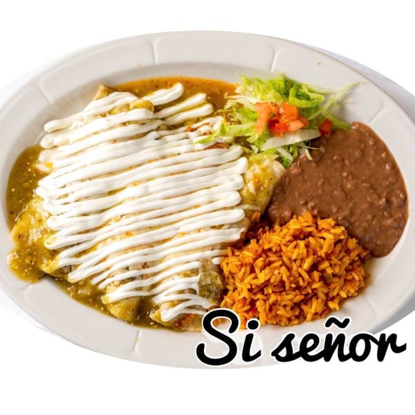Si Senor Mexican Restaurant's enchiladas with green sauce, sour cream, rice, refried beans, and salad.
